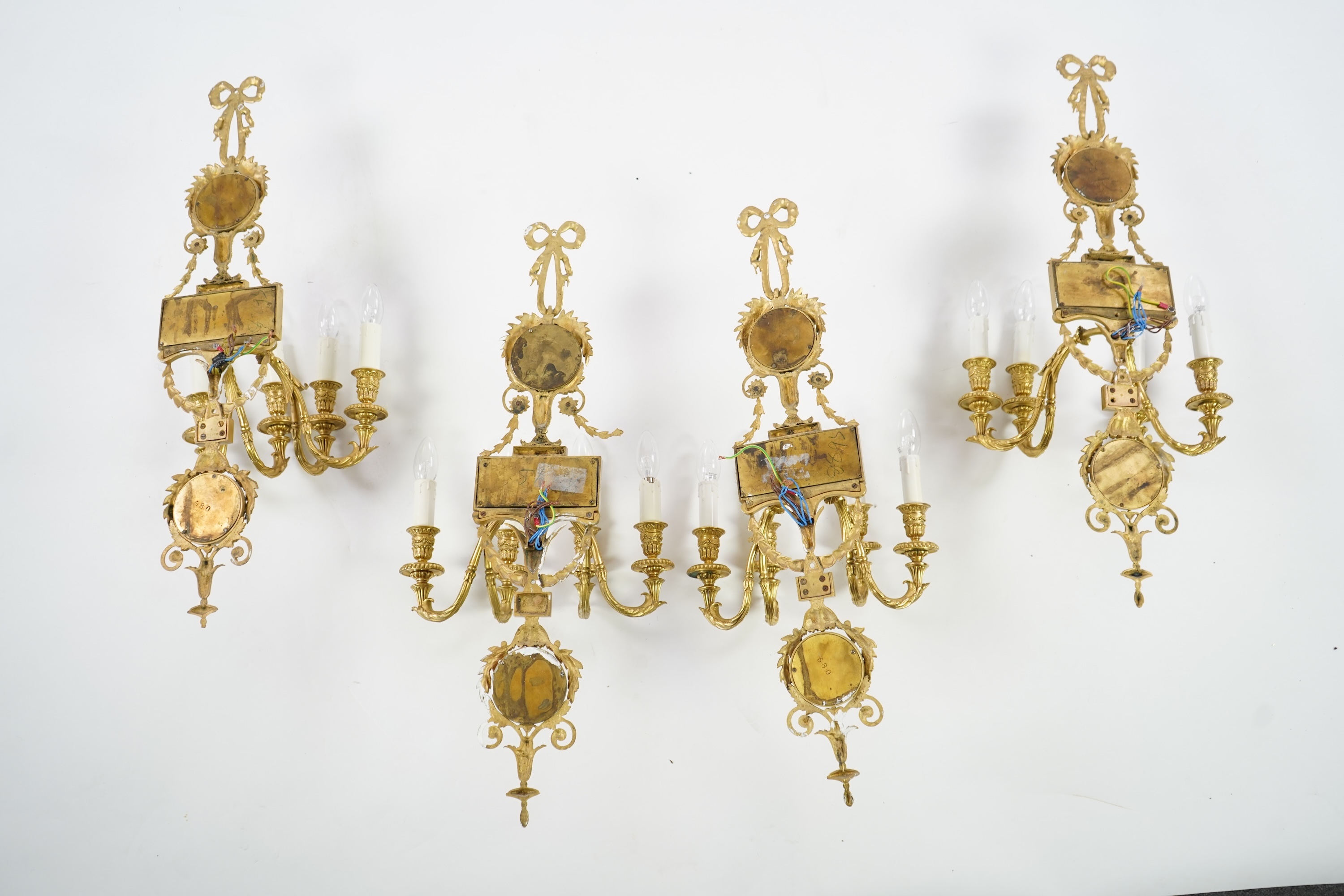 A set of four Adam style ormolu and jasper ware mounted wall appliques, early 20th century